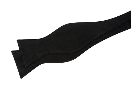Black Ribbed Silk Bow Tie shown untied, laid flat in a draped shape