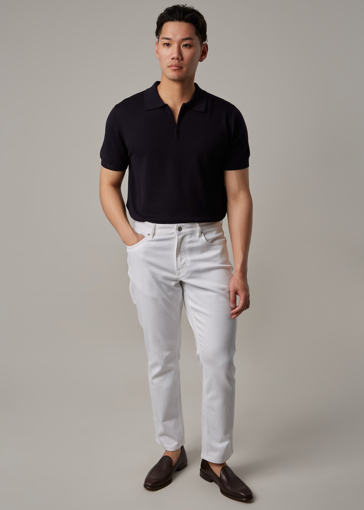 White Denim Jeans, full front view on a model wearing a dark zip polo