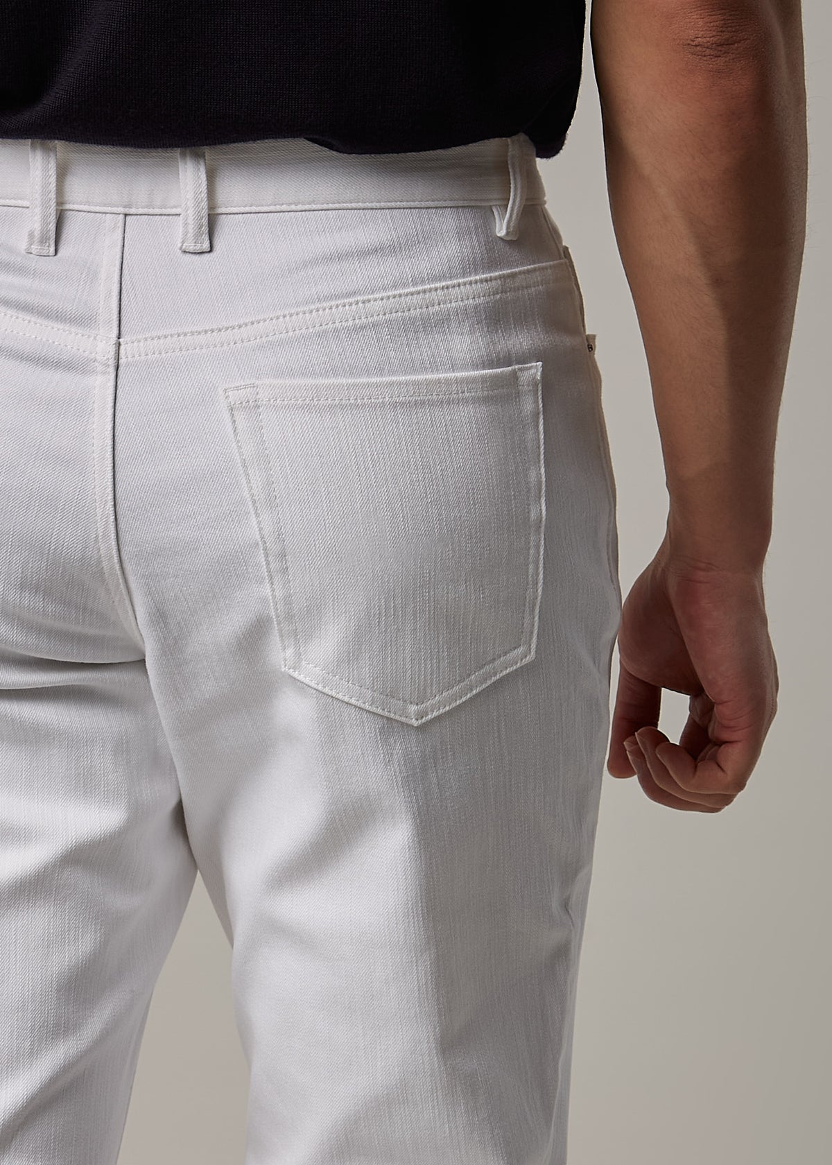 White Denim Jeans, close-up back view of the pocket and waistband