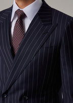 Boston Tie knotted and worn with a pinstripe suit and white shirt, close-up