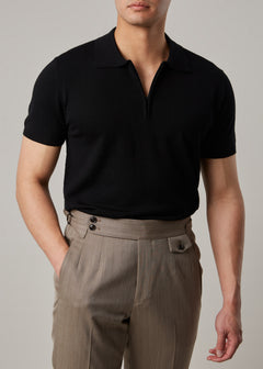 Fireball Zip Polo Black on a model, front view with the half-zip open