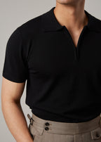 Fireball Zip Polo Black on a model, wider view showing the trouser waistband