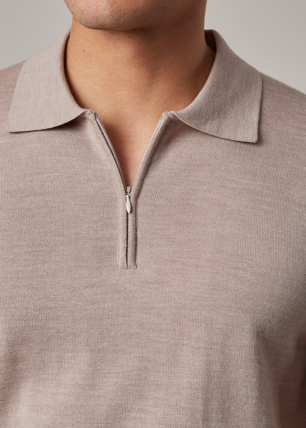 Close-up of the quarter-zip collar on the Fireball Zip Polo Beige