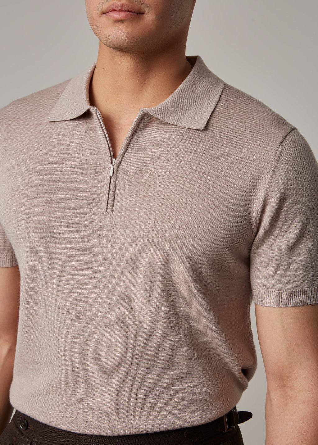 Fireball Zip Polo Beige collar close-up with the trouser waistband in view