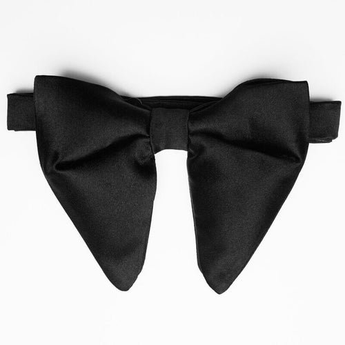 Black Floppy Silk Pre-tied Bow Tie, flat lay on a plain background