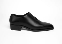 Luxury Black Painted Calf Whole Cut shoe in side profile on a plain background