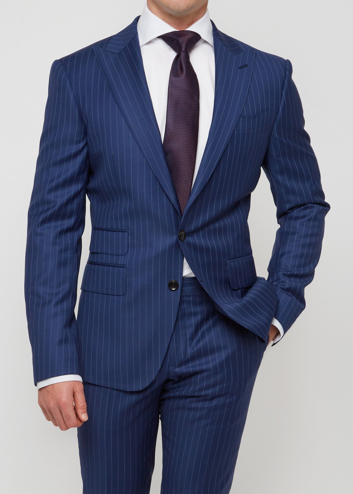 Carnaby Street navy pinstripe suit, close-up of the buttoned jacket and tie