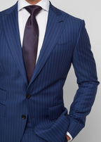 Carnaby Street suit lapel and tie knot close-up, model's hand in pocket