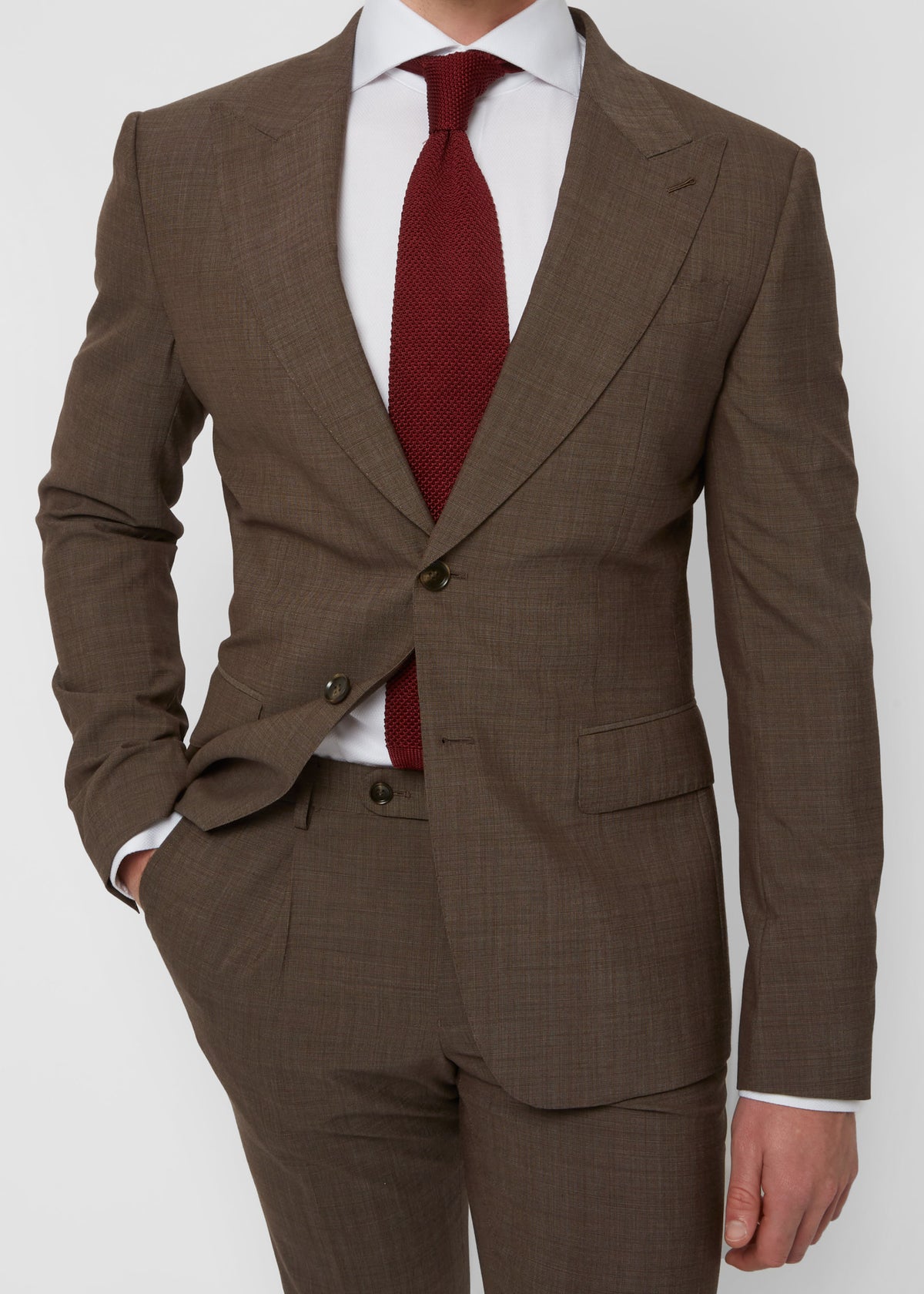 Close-up of the Madison Avenue Brown Suit jacket front, hand in pocket