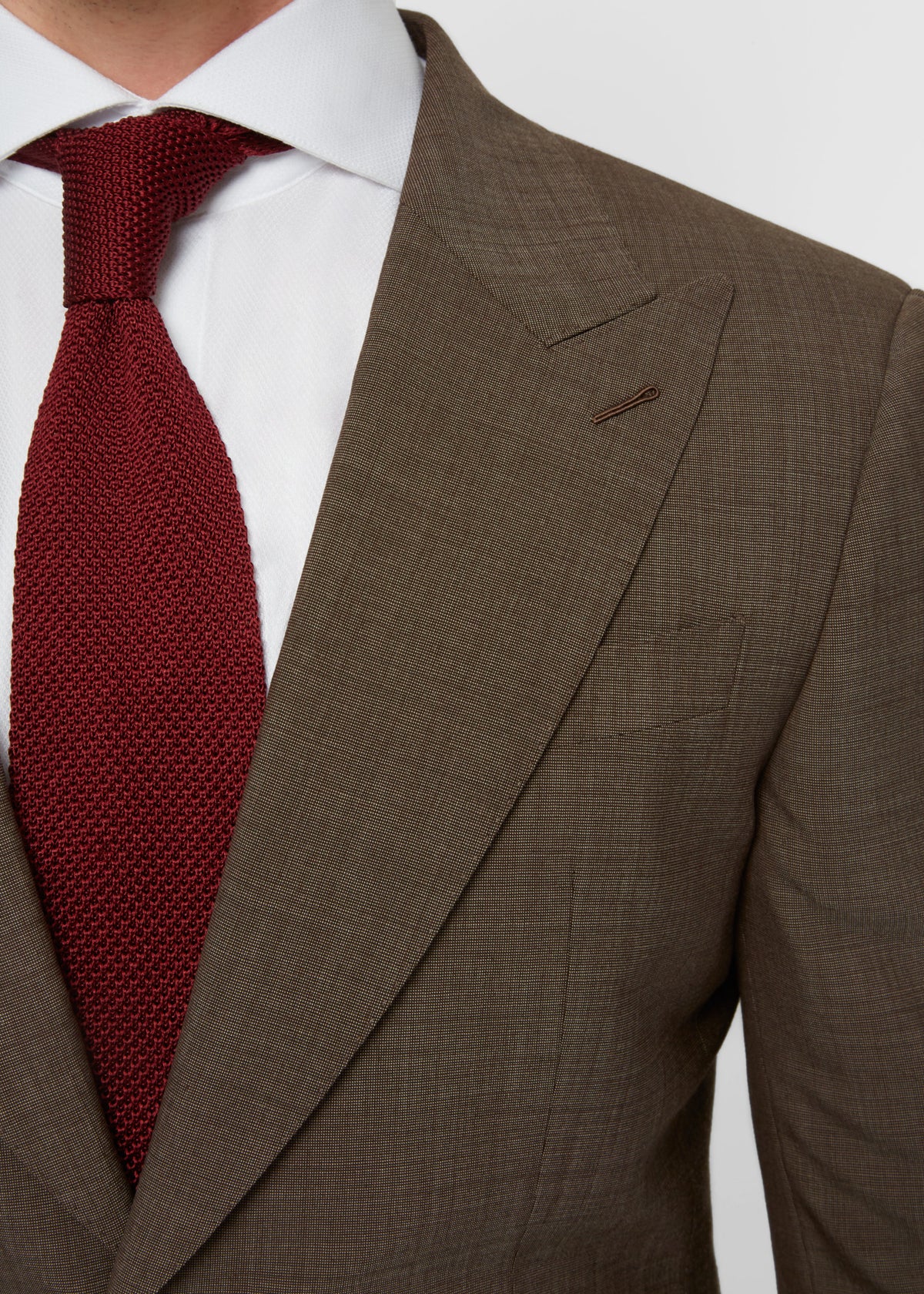 Close-up of the Madison Avenue Brown Suit peak lapel and chest pocket