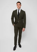 Greenwich Village Olive Suit full front view on a model standing with hand in pocket