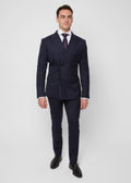 Savile Row Navy Pinstripe Suit worn with a rust tie, front view, hands in pockets