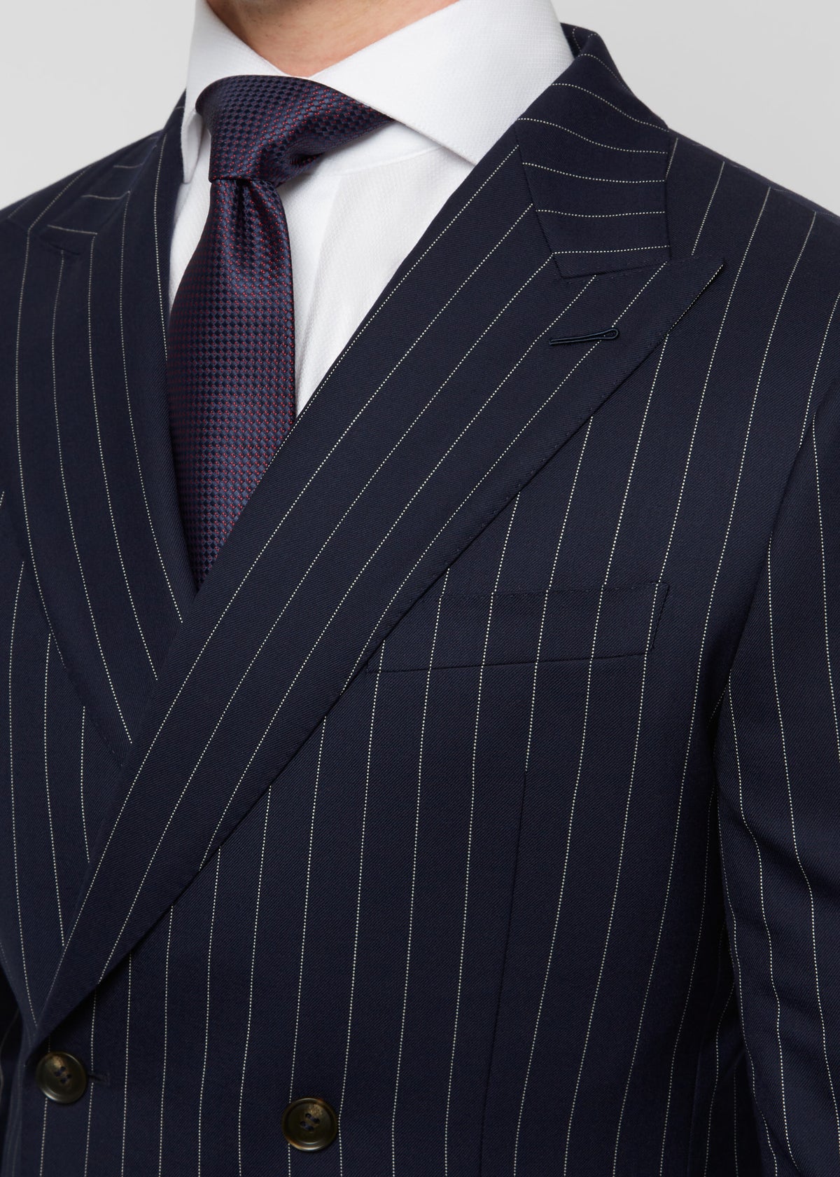 Savile Row Navy Pinstripe Suit double-breasted jacket with a purple tie, full length