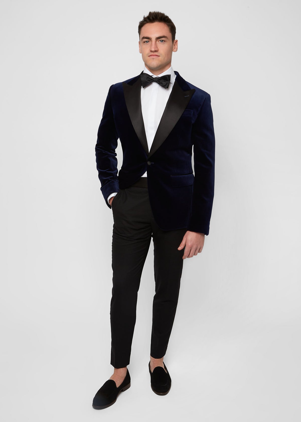 Midnight Luxe Navy Tuxedo worn full-length on a model, hand in pocket