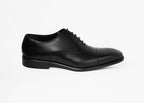 Box Calf Oxford, single shoe shown in side profile on a plain background