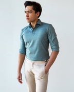 Green Popover Shirt, three-quarter view with sleeves rolled and a hand in the pocket