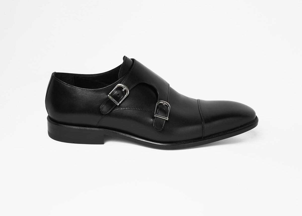 Painted calf double monk shoe in black, single side profile view