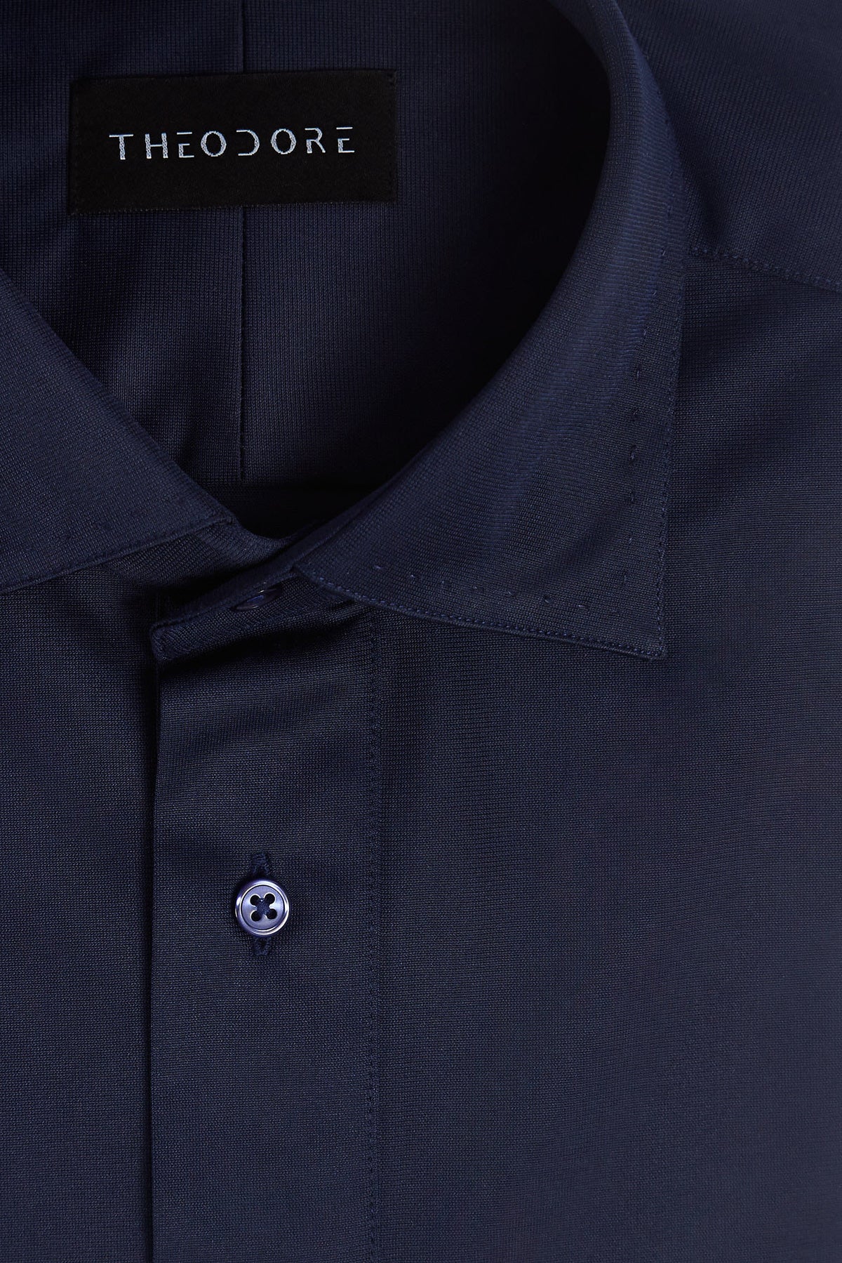Navy Popover Shirt, close-up of the collar and button placket with the THEODORE label