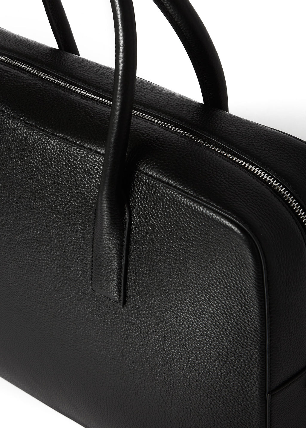 Macro close-up of the Timothy briefcase's zip, gusset and handle base