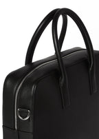 Close-up of the Timothy briefcase's top handles and D-ring hardware