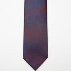 Tokyo Tie in blue micro pattern, flat lay on a plain background