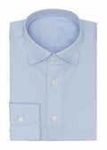 Fine herringbone shirt in light blue, folded flat on a plain background