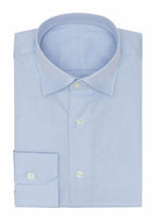 Fine herringbone shirt in light blue, folded flat on a plain background