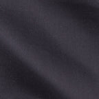 Close-up of the satin piquet black shirt's woven texture