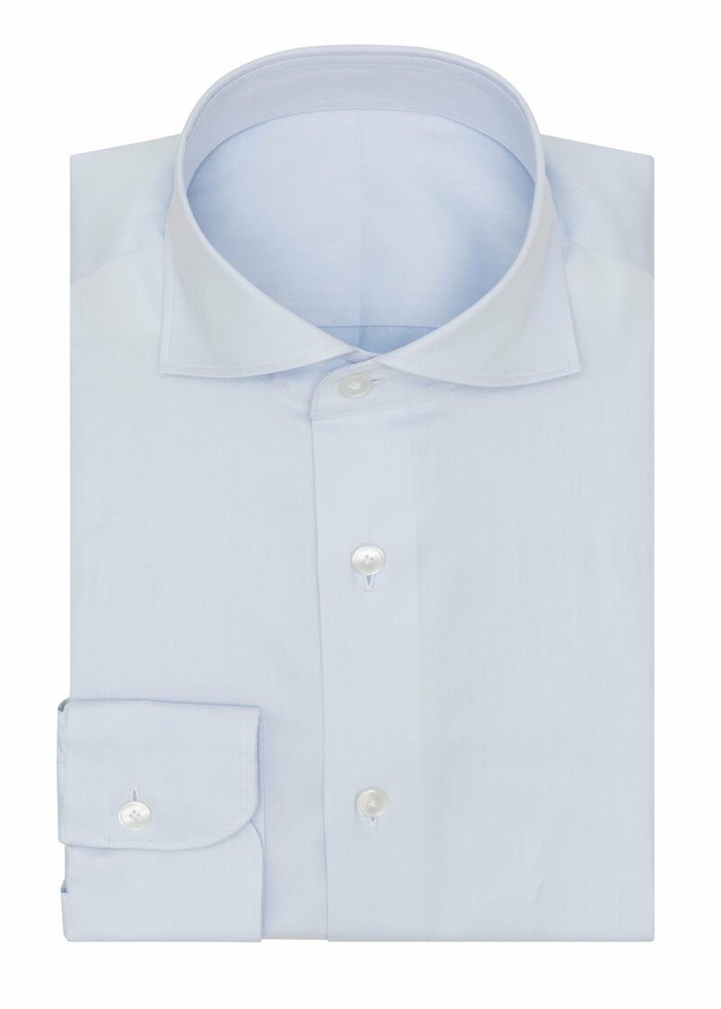 The Perfect Light Blue Shirt folded flat with collar and button placket