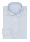 The Perfect Light Blue Shirt folded flat with collar and button placket