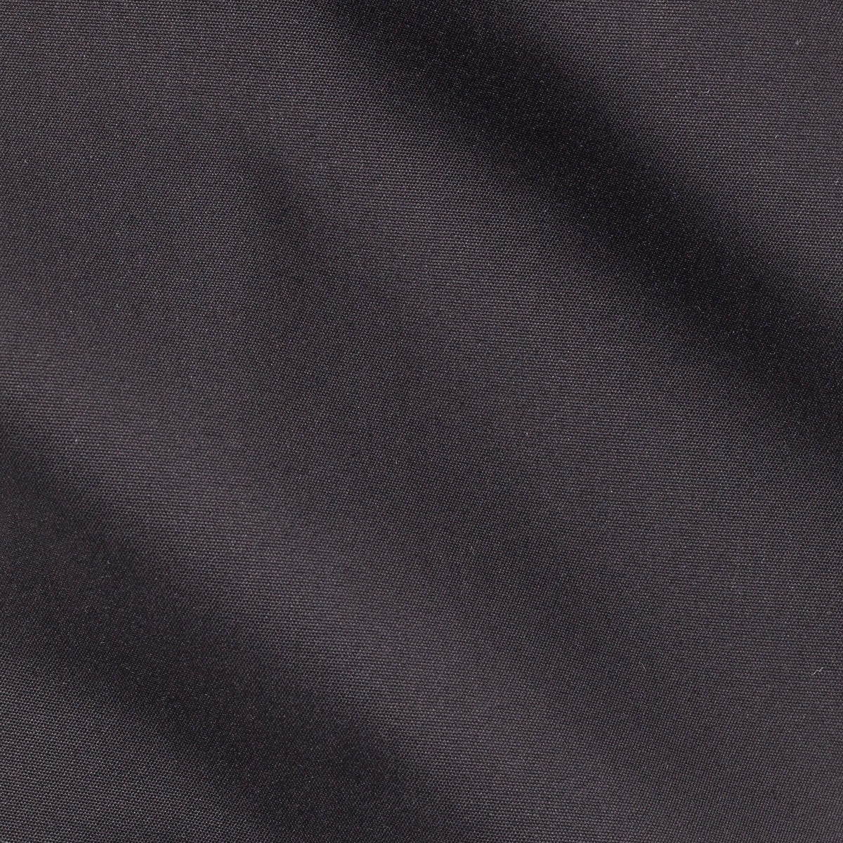 Close-up of the woven texture on the Stretch Black Shirt fabric