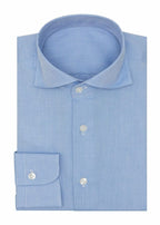 Oxford Mid Blue Shirt folded flat, showing the collar, button placket and cuff