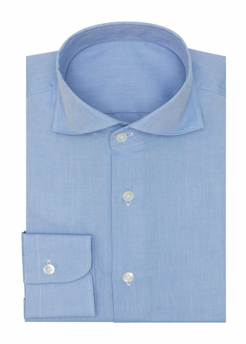 Oxford Mid Blue Shirt folded flat, showing the collar, button placket and cuff