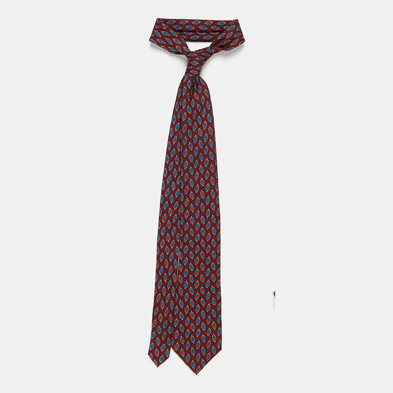 Taipei Tie in a burgundy paisley print, tied and hanging at full length