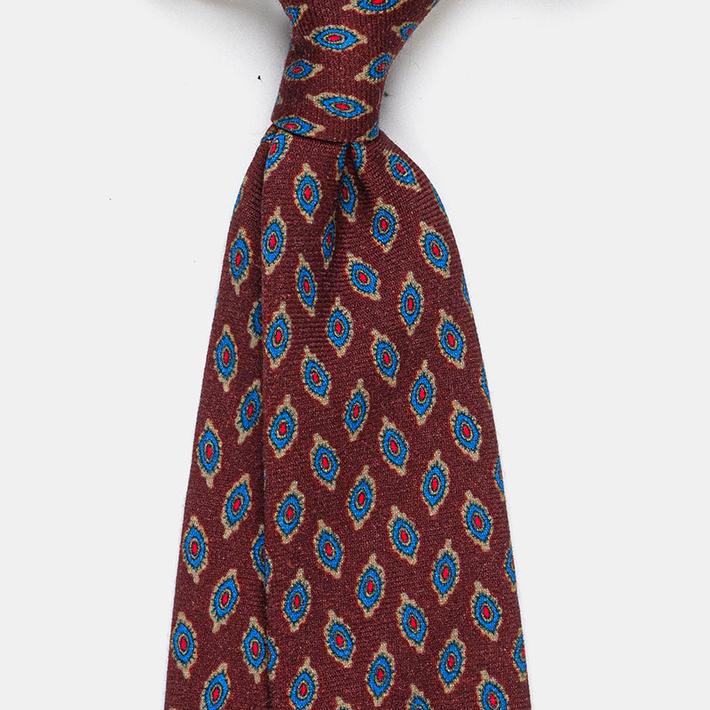 Taipei Tie in a burgundy paisley print, tied in a knot with close-up detail