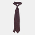 Boston Tie in a navy floral medallion print, knotted and hanging straight