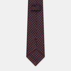 Boston Tie in a navy floral medallion print, keeper loop and tip visible