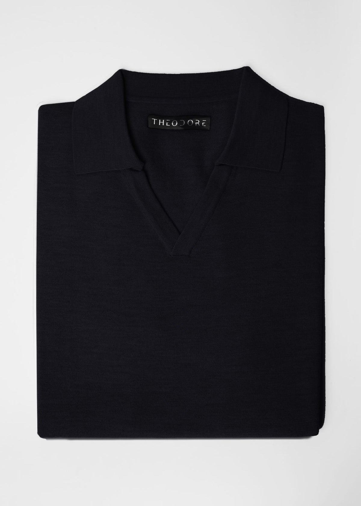 3J Whisky Shot Polo in black, folded flat lay with open collar