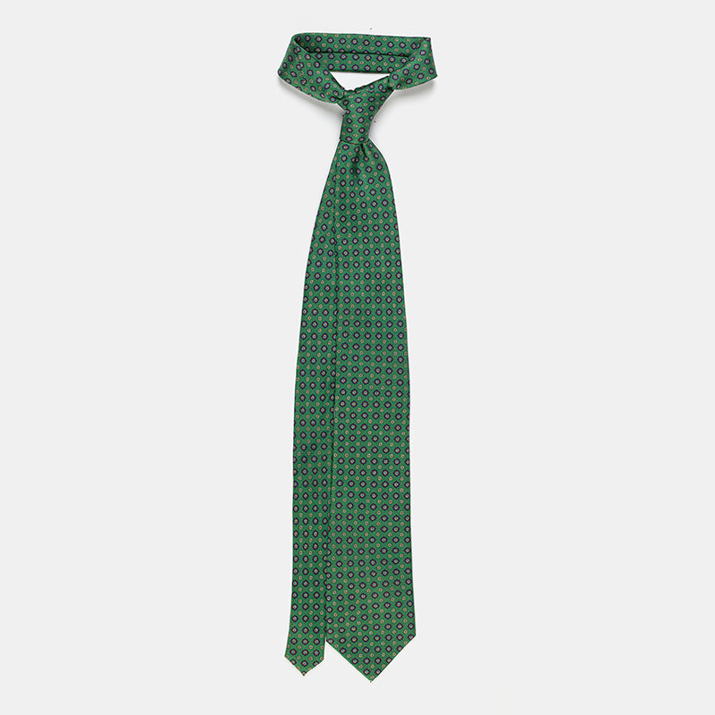 Seattle Tie in a green floral medallion print, knotted with collar open