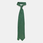 Seattle Tie in a green floral medallion print, knotted with collar open