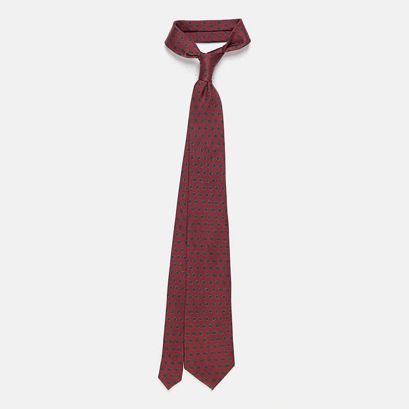 Riga Tie in a burgundy floral medallion print, knotted and hanging straight