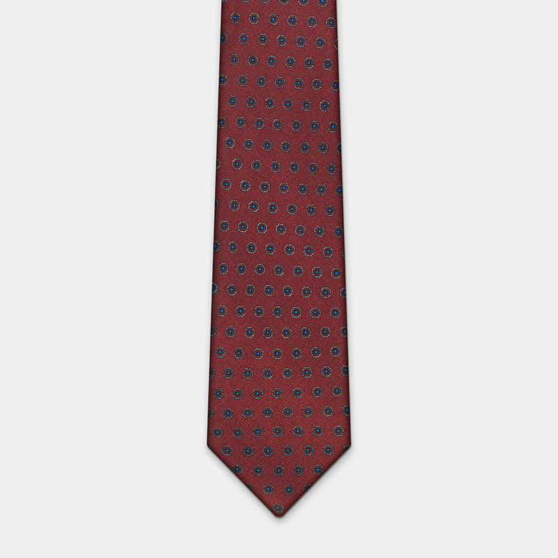 Riga Tie in a burgundy floral medallion print, laid flat in full length