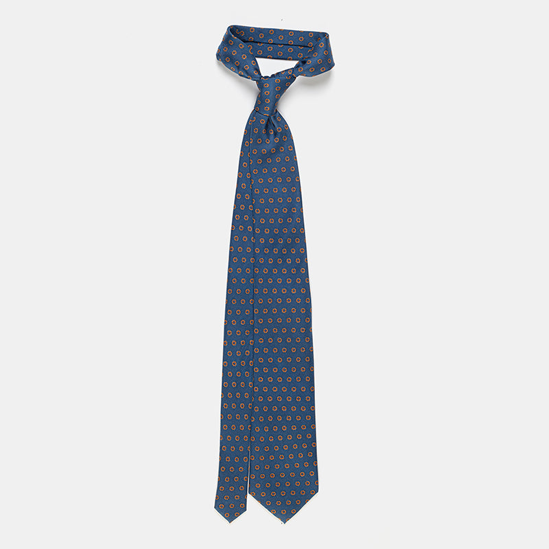 Oslo Tie in a blue floral medallion print, knotted and hanging straight