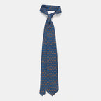 Oslo Tie in a blue floral medallion print, knotted and hanging straight