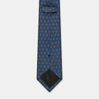 Oslo Tie in a blue floral medallion print, knotted with collar open