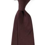 Brussels Tie in solid burgundy, angled close-up view of the knot