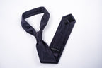 Berlin Tie - Black Micro Dot, shown tied and flat with keeper label