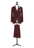 Broadway Burgundy Wool 2.0 Suit displayed on a tailor's dress form with a cream tie