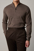 Cosmo quarter-zip jumper in brown, worn on a model with hand in pocket
