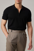 Fireball Zip Polo Black on a model, front view with the half-zip open
